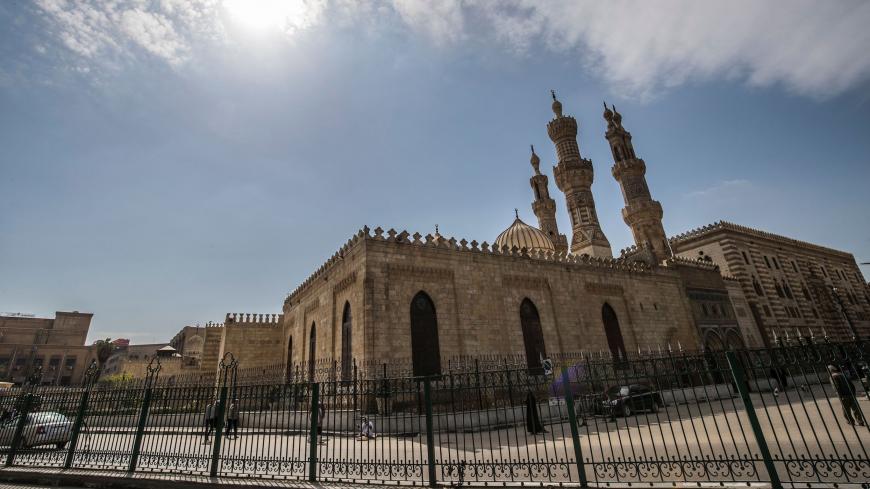 A few people walk in the vicinity of the closed Al-Azhar mosque in Egypt's capital Cairo on March 20, 2020, after the country's Muslim religious authorities decided to put the Friday prayers on hold, in order to avoid gatherings and the spread of the novel coronavirus COVID-19 disease. (Photo by Khaled DESOUKI / AFP) (Photo by KHALED DESOUKI/AFP via Getty Images)