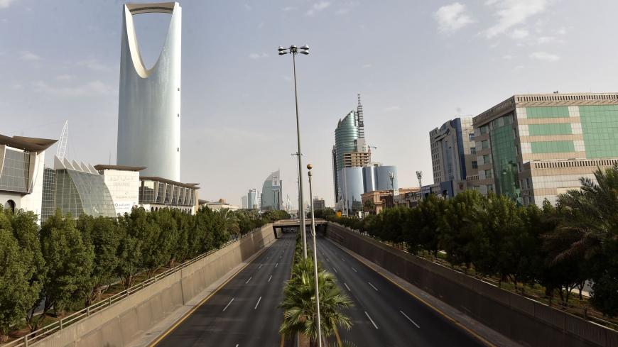 A picture taken on March 26, 2020, shows the main King Fahd road empty in the Saudi capital Riyadh, after the Kingdom began implementing an 11-hour nationwide curfew, on the day of an emergency G20 videoconference, to discuss a response to the COVID-19 crisis. - G20 nations pledged a "united front" Thursday in the fight against coronavirus, saying they were injecting $5 trillion into the global economy to counter the pandemic amid forecasts of a deep recession. US President Donald Trump and Russian Presiden