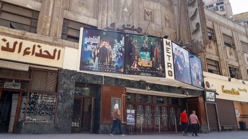 This picture taken on August 26, 2020 shows a view of the historic Metro cinema theatre along the commercial Talaat Harb street in the city centre of Egypt's capital Cairo. - Egyptian cinemas are slowly reopening after months of lockdown, but the huge sector sometimes dubbed the Hollywood of the Arab world has taken a severe hit during the pandemic. After most studios, sets and movie theatres were shuttered because of COVID-19 from at least March to June, filmmakers and the wider sector are bracing for an u
