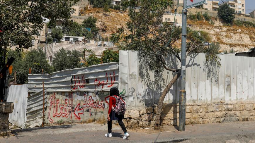 A Palestinian girl walks towards an alley leading to the Qaqaa Bin Amr mosque, in the mostly Arab east Jerusalem neighbourhood of Silwan, on September 15, 2020. - Israeli authorities suspended a demolition order on the two-story building in the Silwan neighbourhood, and granted those in charge of it 21 days to challenge the demolition order. (Photo by AHMAD GHARABLI / AFP) (Photo by AHMAD GHARABLI/AFP via Getty Images)