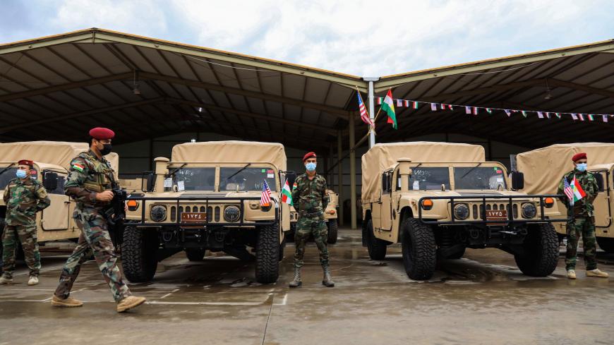 Members of the Iraqi-Kurdish Peshmerga forces attend a handover and US military and logistic assistance distribution ceremony to the Peshmerga Ministry of the Kurdistan Regional Government (KRG) in the Arbil the capital of the autonomous Kurdish region in northern Iraq on November 10, 2020. (Photo by SAFIN HAMED / AFP) (Photo by SAFIN HAMED/AFP via Getty Images)