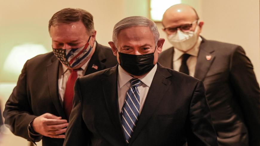 (L to R) US Secretary of State Mike Pompeo, Israeli Prime Minister Benjamin Netanyahu, and Bahrain's Foreign Minister Abdullatif bin Rashid Al Zayani, all mask-clad due to the COVID-19 coronavirus pandemic, arrive for a press conference after their trilateral meeting in Jerusalem on November 18, 2020. (Photo by Menahem KAHANA / POOL / AFP) (Photo by MENAHEM KAHANA/POOL/AFP via Getty Images)