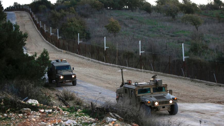Israeli military vehicles near the kibbutz Manara in northern Israel's upper Galilee patrol along the border with Lebanon overlooking the Hula Valley, on December 20, 2020. (Photo by JALAA MAREY / AFP) (Photo by JALAA MAREY/AFP via Getty Images)