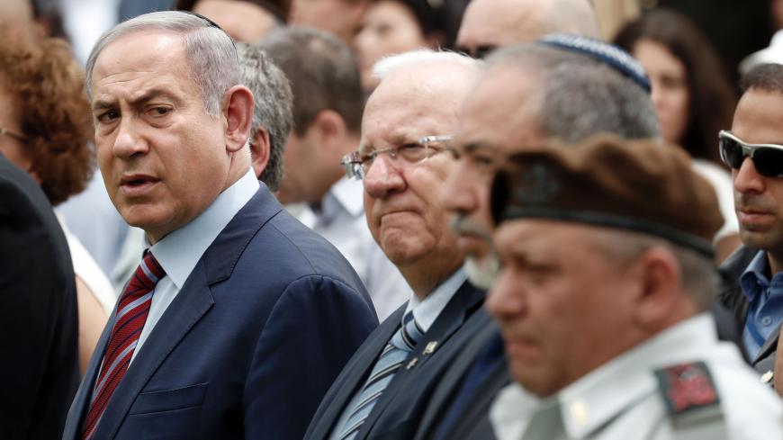 (From L to R) Israeli Prime Minister Benjamin Netanyahu, Israeli President Reuven Rivlin, Israeli Defense Minister Avigdor Lieberman and Israeli Chief of Staff General Gadi Eizenkot attend an official memorial ceremony marking the tenth anniversary of the 2006 war between Israel and Lebanon's Hezbollah movement, at the military cemetery of Mount Herzl in Jerusalem on July 19, 2016.
Israel is marking a decade since its 2006 war with its "main enemy" Hezbollah, but the Lebanese militia's involvement in Syria 
