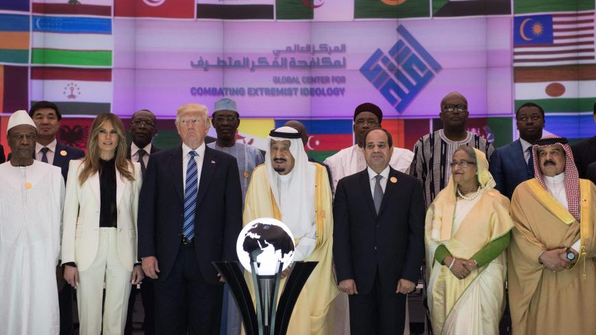 US President Donald Trump (3L), US First lady Melania Trump (2L), Saudi Arabia's King Salman bin Abdulaziz al-Saud (C), and Egypt's President Abdel Fattah el-Sisi (3R) pose for a group photo with other leaders of the Muslim world during the inauguration of the Global Center for Combating Extremist Ideology in Riyadh on May 21, 2017. / AFP PHOTO / MANDEL NGAN        (Photo credit should read MANDEL NGAN/AFP via Getty Images)