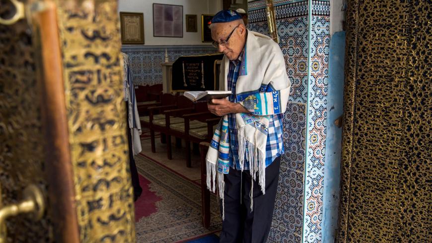 Moroccan Jews and Israeli Jewish tourists participate in a religious ceremony to observe the holiday of Sukkot (the Feast of the Tabernacles) at a synagogue in the "Mellah" Jewish quarter of the Medina in Marrakesh on October 13, 2017.
The once teeming Jewish area of Moroccan tourist gem Marrakesh is seeing its fortunes revived as visitors including many from Israel flock to experience its unique culture and history. / AFP PHOTO / FADEL SENNA        (Photo credit should read FADEL SENNA/AFP via Getty Images