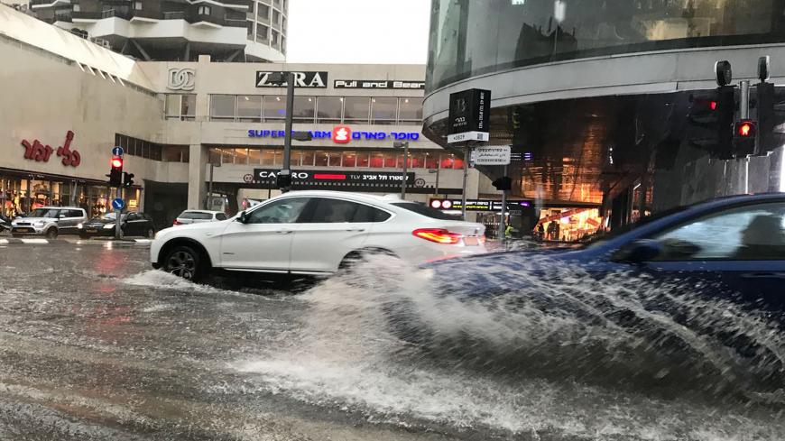Motorists plough their vehicles through flooded streets after a winter storm hit the Israeli coastal city of Tel Aviv, on January 25, 2018.  / AFP PHOTO / - / Israel OUT        (Photo credit should read -/AFP via Getty Images)
