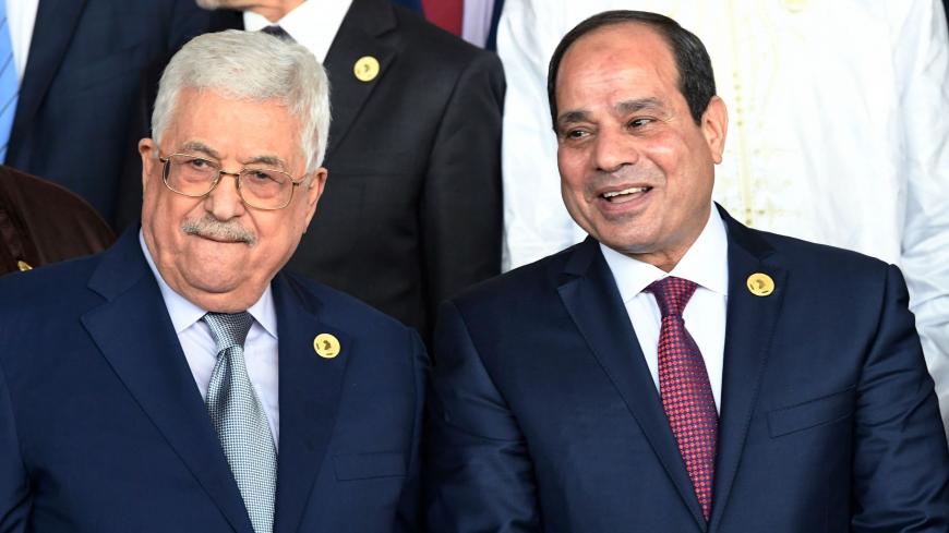 Egyptian President Abdel Fattah al-Sisi (R) speaks with with Palestinian President Mahmoud Abbas as they pose for a family a photo at the opening of the Ordinary Session of the Assembly of Heads of State and Government during the 30th annual African Union summit in Addis Ababa on January 28, 2018.  / AFP PHOTO / SIMON MAINA        (Photo credit should read SIMON MAINA/AFP via Getty Images)