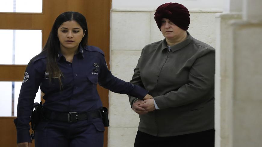 Malka Leifer, a former Australian teacher accused of dozens of cases of sexual abuse of girls at a school, arrives for a hearing at the District Court in Jerusalem on February 27, 2018. - Israel on February 12 arrested the Australian woman who is wanted in her home country on child sex abuse charges, police announced. The suspect has been living in a West Bank settlement for the past decade following a complaint filed against her by a former student at a Jewish ultra-Orthodox school she ran in Melbourne. (P