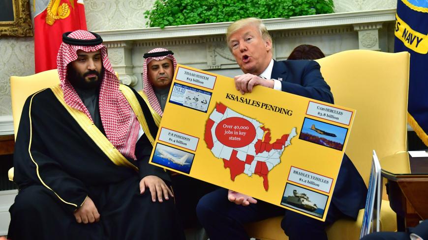 WASHINGTON, DC - MARCH 20: President Donald Trump (R) holds up a chart of military hardware sales as he meets with Crown Prince Mohammed bin Salman of the Kingdom of Saudi Arabia in the Oval Office at the White House on March 20, 2018 in Washington, D.C.  (Photo by Kevin Dietsch-Pool/Getty Images)