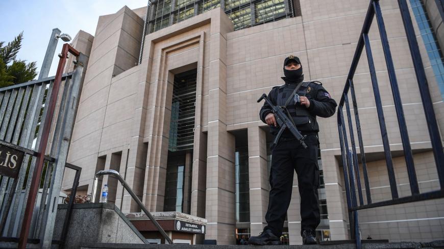 A Turkish policeman stands guard outside the courthouse in Istanbul on March 28, 2019, during the trial of Metin Topuz, an US consulate staffer accused of spying and attempting to overthrow the government. - Topuz, a Turkish citizen and liaison with the US Drug Enforcement Administration, was arrested in 2017 and has been accused of ties to US-based preacher Fethullah Gulen who Ankara says ordered a failed 2016 coup. (Photo by OZAN KOSE / AFP)        (Photo credit should read OZAN KOSE/AFP via Getty Images)