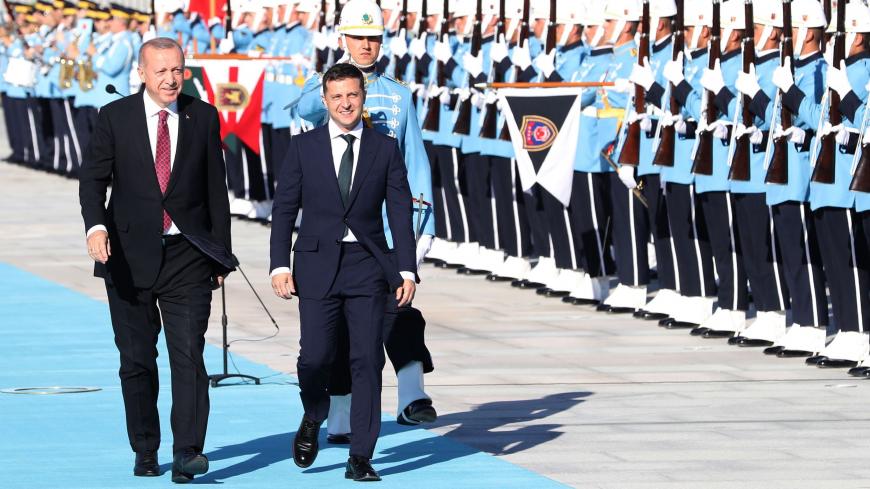 Turkey's President Recep Tayyip Erdogan (L) and Ukraine's President Volodymyr Zelensky (R) review a guard of honor during an official welcoming ceremony at the Presidential Complex in Ankara on August 7, 2019. (Photo by Adem ALTAN / AFP)        (Photo credit should read ADEM ALTAN/AFP via Getty Images)