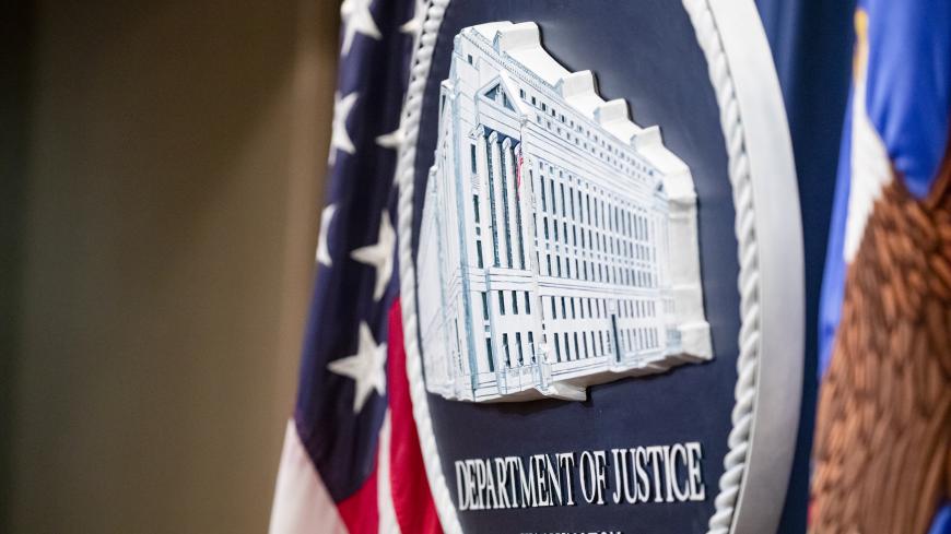 WASHINGTON, DC - DECEMBER 05: The U.S. Department of Justice seal on the stage where U.S. and U.K. Law enforcement officials will announce warrants for the arrests of Maksim Viktorovich Yakubets and Igor Olegovich Turashev, two Russian hackers associated with a group called Evil Corp., at the U.S. Department of Justice on December 5, 2019 in Washington, DC. Today the U.S. Department of Justice, Federal Bureau of Investigations (FBI), and the U.S. Treasury Department’s Office of Foreign Assets Control (OFAC)