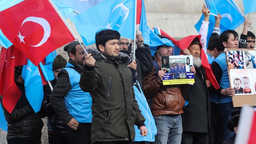 Uighurs living in Turkey stage a demonstration to commemorate the anniversary of the deadly ethnic unrests of 1997 in Gulja, China's far-western Xinjiang Uighur Autonomous Region, in Ankara on February 5, 2020. (Photo by Adem ALTAN / AFP) (Photo by ADEM ALTAN/AFP via Getty Images)