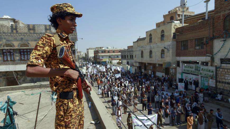 A fighter loyal to Yemen's Huthi rebels stands guard during a rally commemorating the death of Shiite Imam Zaid bin Ali in the capital Sanaa, on September 14, 2020. (Photo by Mohammed HUWAIS / AFP) (Photo by MOHAMMED HUWAIS/AFP via Getty Images)