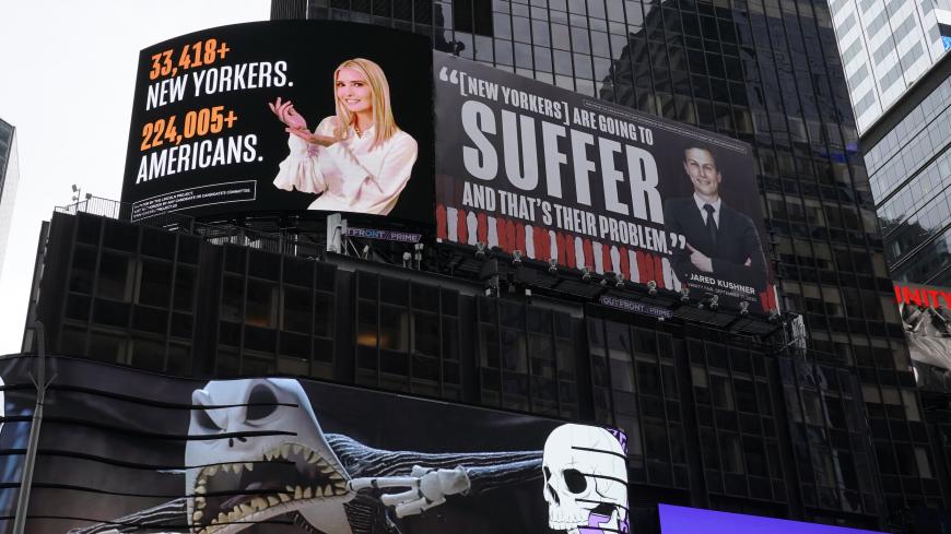 A billboard by The Lincoln Project is seen in Times Square on October 25, 2020 in New York, depicting Ivanka Trump presenting the number of New Yorkers and Americans who have died due to Covid-19 along with her husband Senior Advisor to the President Jared Kushner, with a Vanity Fair quote. - The Lincoln Project, is defending its right to erect billboards in Times Square critical of Ivanka Trump and Jared Kushner,after an attorney for President Trump's daughter and her husband threatened to sue. (Photo by T
