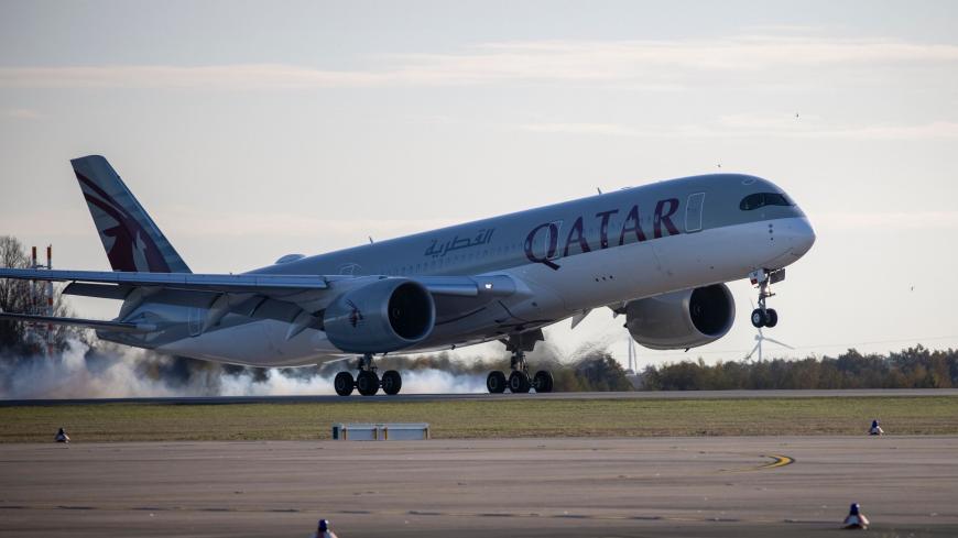 An Airbus A350 plane of Qatar Airways from Doha is pictures after it landed at Berlin's airport "Berlin Brandenburg Airport Willy Brandt", during the opening of the southern runway of the airport, in Schoenefeld, southeast of Berlin, on November 4, 2020. - Passenger flights are to began landing on October 31, 2020 at Berlin's new international airport, a moment many Germans thought they might never see after years of embarrassing delays and spiralling costs. (Photo by Odd ANDERSEN / AFP) (Photo by ODD ANDER