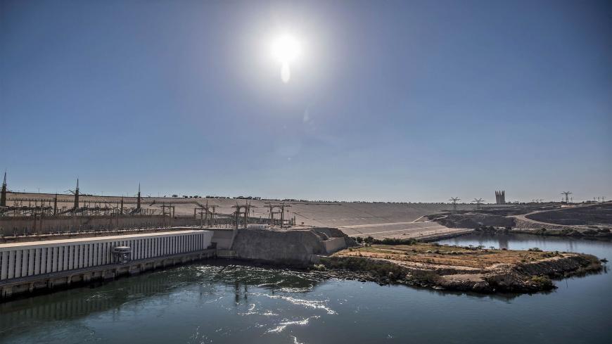 A general view shows Egypt's High Dam in Aswan, some 920 kilometres south of the capital Cairo, on January 3, 2021. - Half a century since Egypt's Aswan dam was inaugurated to much fanfare, harnessing the Nile for hydropower and irrigation, the giant barrier is still criticised its human and environmental toll. But it is also a stark reminder -- amid high tensions today as Addis Ababa fills its collosal Grand Ethiopian Renaissance Dam (GERD) upstream, Africa's largest -- of just how volatile politics over t