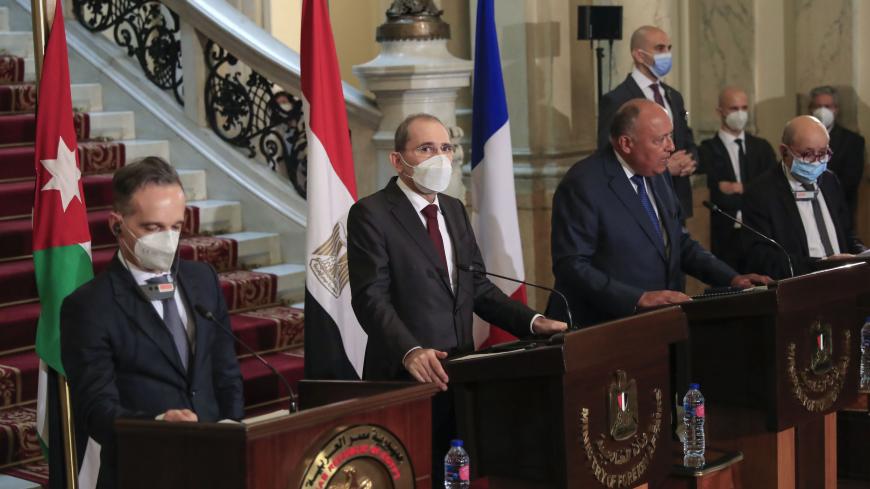 Foreign Ministers of (L to R) Germany Heiko Maas, Jordan Ayman Safadi, Egypt Sameh Shoukry, and France Jean-Yves Le Drian, hold a joint press conference after a meeting to discuss the Middle East peace process, in the Egyptian capital Cairo, on January 11, 2021. (Photo by Khaled DESOUKI / AFP) (Photo by KHALED DESOUKI/AFP via Getty Images)