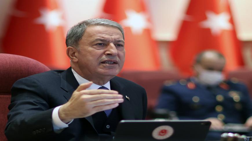 Turkish National Defence Minister Hulusi Akar gives a press conference at the ministry in Ankara on January 13, 2021. (Photo by Arif AKDOGAN / POOL / AFP) (Photo by ARIF AKDOGAN/POOL/AFP via Getty Images)