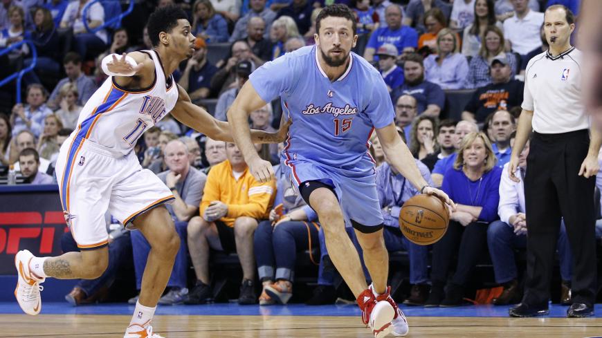 OKLAHOMA CITY, OK - FEBRUARY 8: Hedo Turkoglu #15 of the Los Angeles Clippers handles the ball against Jeremy Lamb #11 of the Oklahoma City Thunder during the game at Chesapeake Energy Arena on February 8, 2015 in Oklahoma City, Oklahoma. The Thunder defeated the Clippers 131-108. NOTE TO USER: User expressly acknowledges and agrees that, by downloading and/or using this Photograph, user is consenting to the terms and conditions of the Getty Images License Agreement. (Photo by Joe Robbins/Getty Images) 