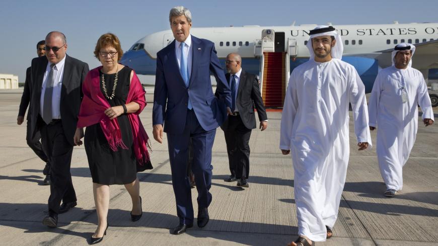 US Secretary of State John Kerry (C) walks with Deputy Chief of Mission Ethan Goldrich (far L), US Ambassador to the United Arab Emirates Barbara Leaf (2nd L) and Emirati Foreign Minister Sheikh Abdullah bin Zayed Al Nahyan (R) upon his arrival in Abu Dhabi, on November 23, 2015. Kerry arrived in Abu Dhabi on November 23 to meet his Emirati counterparts on efforts to build a Syrian opposition coalition to lead peace talks with the Damascus regime.     AFP PHOTO / POOL / Jacquelyn Martin        (Photo credit