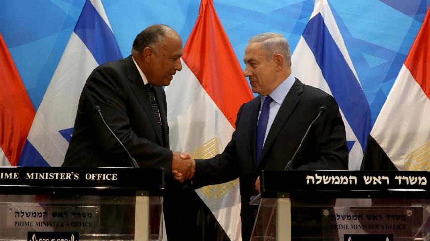Israeli Prime Minister Benjamin Netanyahu (R) shakes hands with Egyptian Foreign Minister Sameh Shoukry after giving a joint statement prior to their meeting at his Jerusalem office on July 10, 2016.
Shoukry met Netanyahu in Jerusalem for talks on reviving peace efforts with the Palestinians, in the first such visit in nearly a decade and the latest sign of warming ties.

 / AFP / GALI TIBBON        (Photo credit should read GALI TIBBON/AFP via Getty Images)