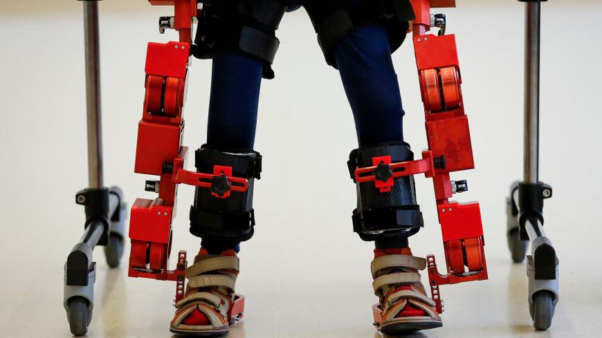 Jens, a 5 years-old boy diagnosed with spinal muscular atrophy (SMA), walks with a new Marsi Bionics exoskeleton designed for children at Sant Joan de Deu Hospital in Barcelona on November 29, 2017. / AFP PHOTO / PAU BARRENA        (Photo credit should read PAU BARRENA/AFP via Getty Images)