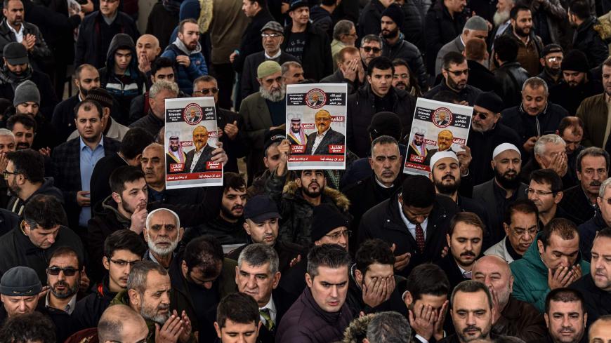 People hold banners of Jamal Khashoggi during a symbolic funeral prayer for the Saudi journalist, killed and dismembered in the Saudi consulate in Istanbul in October, at the courtyard of Fatih mosque in Istanbul, on November 16, 2018. - Turkey has more evidence contradicting the Saudi version of the murder of journalist Jamal Khashoggi including a second audio recording, revealing that the murder had been premeditated, a Turkish newspaper reported on November 16, a contradiction to the statement of the Sau