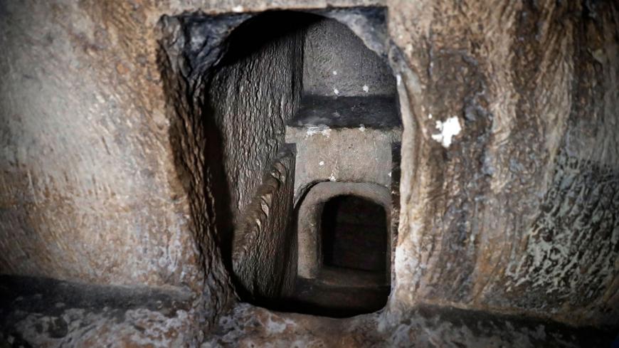 One of the several burial chambers of the Tombs of the Kings, owned and administered by the French Consulate of Jerusalem, is pictured on December 28, 2018 in East Jerusalem. - The ancient site, which is considered the grandest burial compound in the holy city and has been closed for years, includes a sophisticated burial cave that has a mechanism for sealing the entrance by means of a stone that rotates on a hinge. (Photo by THOMAS COEX / AFP)        (Photo credit should read THOMAS COEX/AFP via Getty Imag