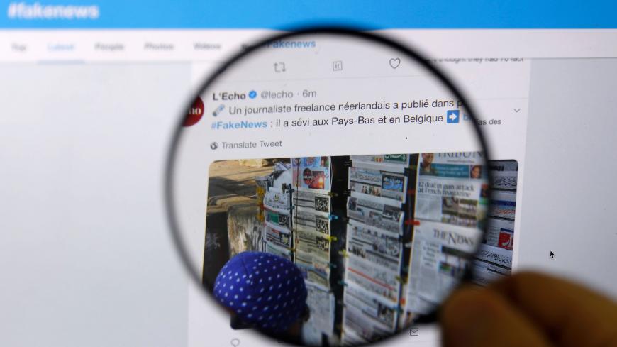 An engineer from the Israeli company "Commun.it" uses his expertise in social media commercial analysis to identify networks of fake users during at the group's office in the Israeli city of Bnei Brak near Tel Aviv on January 23, 2019. - A coalition of Israeli diplomats, programmers and hackers have joined forces to stave off threats -- including from hostile states -- by identifying networks on social media and getting them removed. (Photo by JACK GUEZ / AFP)        (Photo credit should read JACK GUEZ/AFP 