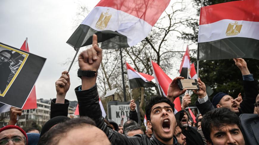 People shout slogans and hold Egyptian flags in front of the Egyptian consulate in Istanbul on march 2, 2019 during a demonstration against death penalties in Egypt after the recent execution of nine men. - Egypt on February 20 hanged nine men for the 2015 assassination of prosecutor general Hisham Barakat following jihadist calls for attacks on the judiciary to avenge the government's crackdown on Islamists. Turkish President sharply criticised his Egyptian counterpart and called for the release of Muslim 