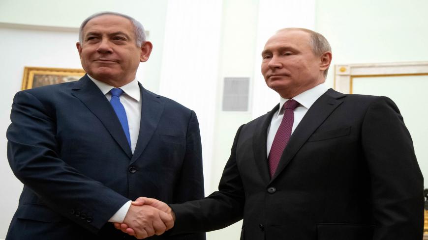 Russian President Vladimir Putin (R) shakes hands with Israeli Prime Minister Benjamin Netanyahu, during their meeting at the Kremlin in Moscow on April 4, 2019. (Photo by Alexander Zemlianichenko / POOL / AFP)        (Photo credit should read ALEXANDER ZEMLIANICHENKO/AFP via Getty Images)