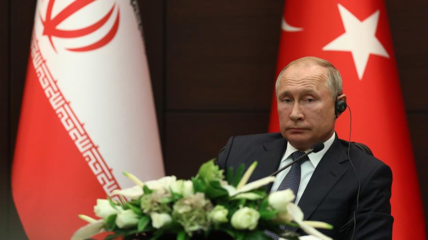 Russian President Vladimir Putin attends a press conference with Turkish President and Iranian President  after their summit in Ankara, on September 16, 2019. (Photo by Adem ALTAN / AFP)        (Photo credit should read ADEM ALTAN/AFP via Getty Images)