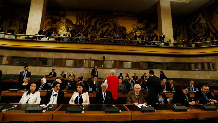 Members of the civil society delegation attend the first meeting of the new Syrian Constitutional Committee at the United Nations in Geneva on October 30, 2019. - Syria's government may be on board for the UN-brokered review of its constitution, but it will sink the Geneva talks opening on October 30, 2019, before agreeing anything that compromises its authority, experts have said. (Photo by DENIS BALIBOUSE / POOL / AFP) (Photo by DENIS BALIBOUSE/POOL/AFP via Getty Images)