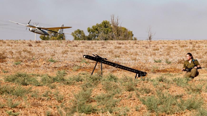 An Israeli soldier watches an Elbit Systems Skylark I unmanned aerial vehicle (UAV or drone) taking off near the border with the Gaza Strip in southern Israel on August 21, 2020, as part of monitoring operations in the area. (Photo by JACK GUEZ / AFP) (Photo by JACK GUEZ/AFP via Getty Images)