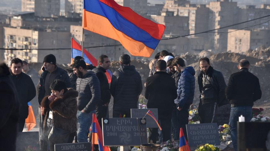 Relatives of the victims of the war over Karabakh, gather for a memorial ceremony, at the Yerablur Military Memorial Cemetery in Yerevan, on December 19, 2020. - Armenian Prime Minister Nikol Pashinyan led, on December 19, 2020, thousands in a march in memory of those killed in a six-week war with Azerbaijan as the Caucasus country began three days of mourning. Pashinyan has been under huge pressure from the opposition to step down after nearly 3,000 Armenians were killed in the clashes with Azerbaijan over