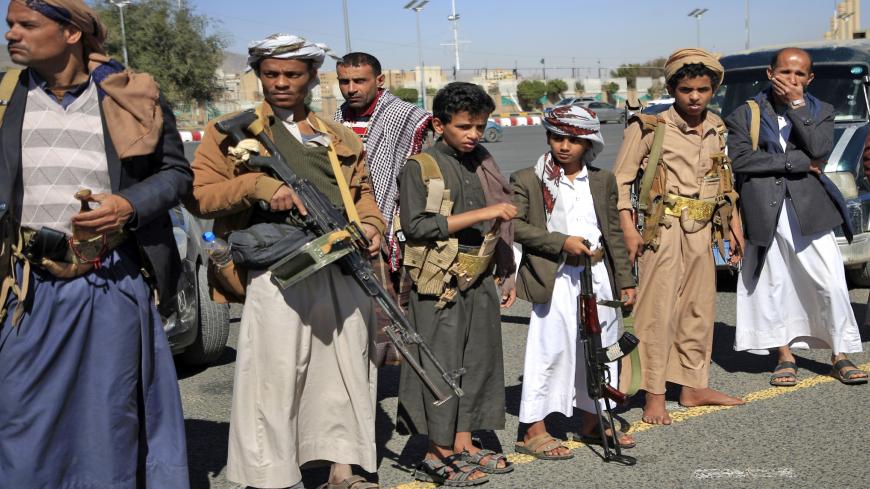 Yemeni tribesmen attend a rally denouncing the United States and the outgoing Trump administration's decision to apply the "terrorist" designation to the Iran-backed movement, in the Huthi-held capital Sanaa on February 4, 2021. - Washington is reviewing the designation by the Trump administration, which came into effect the day before Joe Biden took office and sparked fears of further catastrophe in the war-torn country. (Photo by Mohammed HUWAIS / AFP) (Photo by MOHAMMED HUWAIS/AFP via Getty Images)