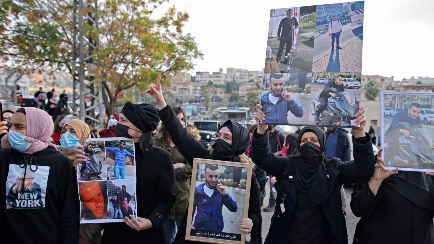 Israeli Arab women take part in a protest after a student was killed in a reported police shootout this week, in the northern Arab-Israeli town of Umm-Al Fahem  on February 5, 2021. - Hundreds of Arab Israelis demonstrated protesters defied coronavirus restrictions on gatherings to demonstrate in front of the police station in the Arab-Israeli city of Umm al-Fahm. (Photo by AHMAD GHARABLI / AFP) (Photo by AHMAD GHARABLI/AFP via Getty Images)