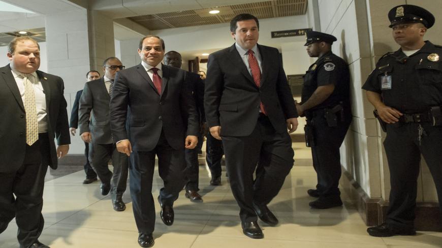 Egypt's President Abdel Fattah el-Sisi (2nd L) walks alongside US Representative Devin Nunes (2ndR), Republican of California and chairman of the House Intelligence Committee, following a meeting at the US Capitol in Washington, DC, April 4, 2017. / AFP PHOTO / SAUL LOEB        (Photo credit should read SAUL LOEB/AFP via Getty Images)