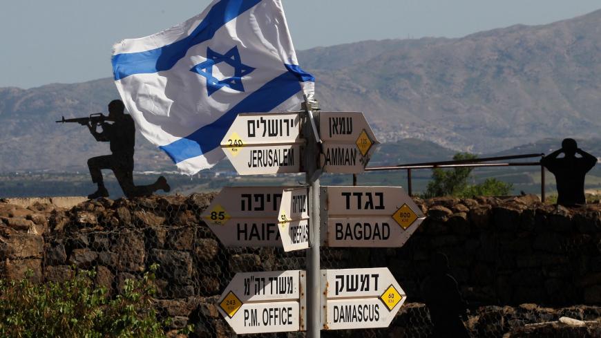 TOPSHOT - An Israeli flag is seen placed on Mount Bental in the Israeli-annexed Golan Heights on May 10, 2018. - Israel's army said today it had carried out widespread raids against Iranian targets in Syria overnight after rocket fire towards its forces it blamed on Iran, marking a sharp escalation between the two enemies. Israel carried out the raids after it said around 20 rockets, either Fajr or Grad type, were fired from Syria at its forces in the occupied Golan Heights at around midnight. (Photo by JAL