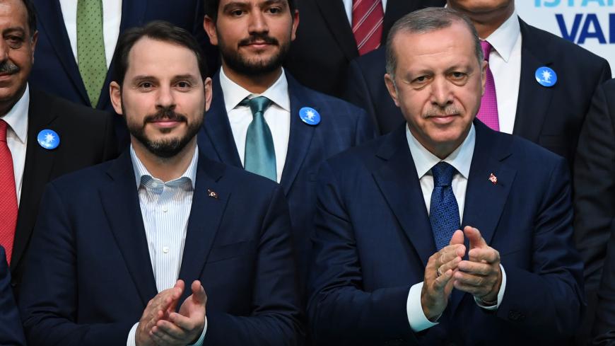 Turkish President Recep Tayyip Erdogan (R) poses with the parliamentary member candidate Turkish Energy Minister Beraat Albayrak (L) on May 29, 2018 in Istanbul during an electoral meeting presenting candidates for the upcoming parliamentary elections. - Turkey holds snap parliamentary and presidential elections on June 24. (Photo by OZAN KOSE / AFP)        (Photo credit should read OZAN KOSE/AFP via Getty Images)
