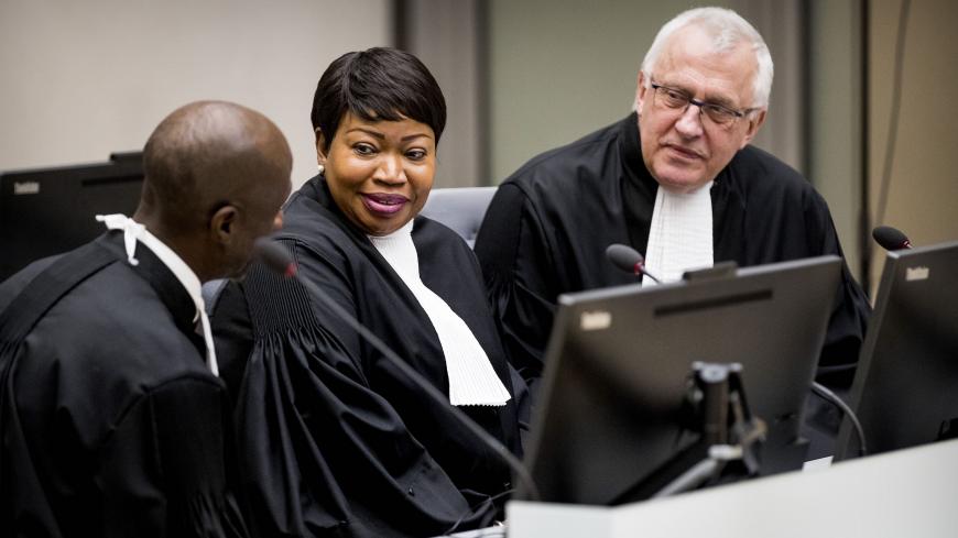 International Criminal Court (ICC) chief prosecutor Fatou Bensouda (C) and deputy prosecutor James Stewart (R) attend the initial appearance before judges of member of the board of the Confederation of African Football (CAF), Patrice-Edouard Ngaissona of the Central African Republic, at the ICC in The Hague on January 25, 2019, following his extradition from France on charges of war crimes and crimes against humanity. - Ngaissona is charged with coordinating so-called anti-Balaka militia which emerged after