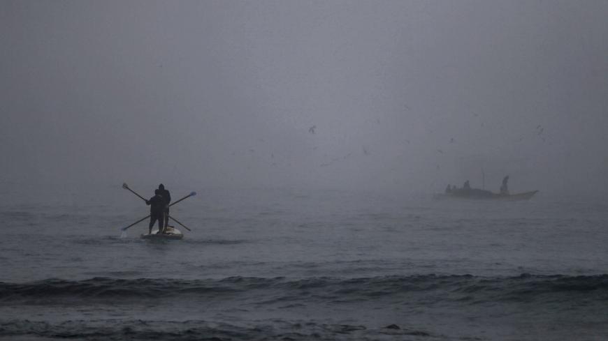 Palestinian fishermen set out to sea amid heavy morning fog in Gaza City, on January 3, 2021. (Photo by Mohammed ABED / AFP) (Photo by MOHAMMED ABED/AFP via Getty Images)