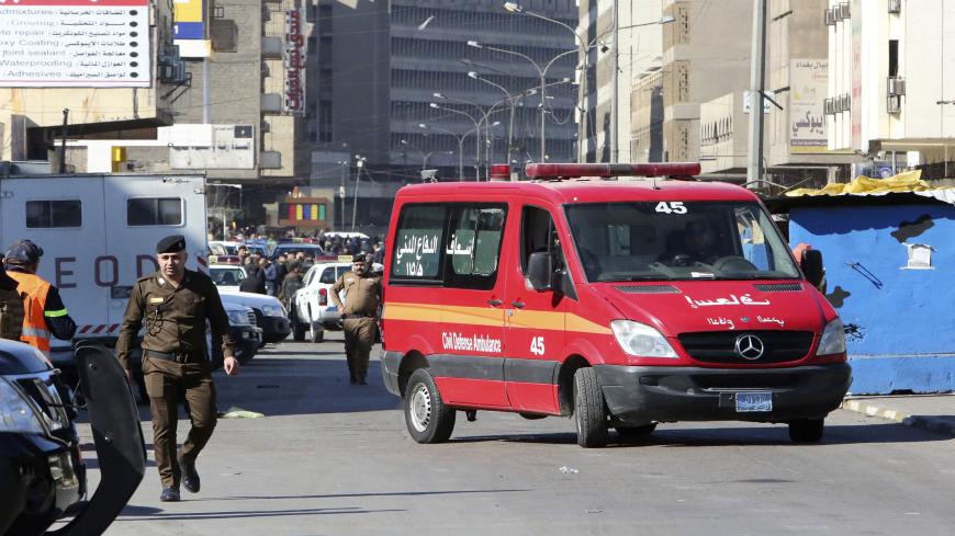 A picture shows the scene of a twin suicide bombing on a bustling commercial street in the heart of Baghdad on January 21, 2021. - The toll in a twin suicide bombing in an open-air Baghdad market morning topped 20 dead and 40 wounded, an interior ministry official told AFP. The ministry said the first suicide bomber had rushed into the market and claimed to feel sick, so that people would gather around him. He then detonated his explosives. (Photo by Sabah ARAR / AFP) (Photo by SABAH ARAR/AFP via Getty Imag
