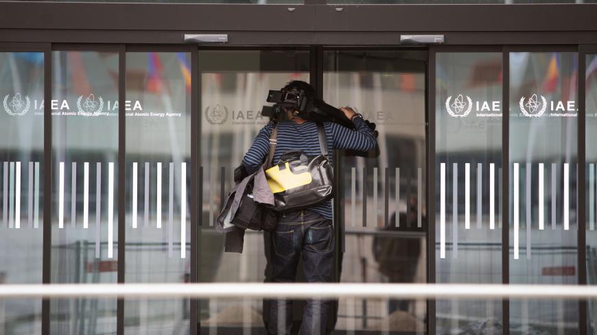 A cameraman arrives at the International Atomic Energy Agency (IAEA),prior to a press conference at the agency's headquarters in Vienna on March 4, 2021. - European nations will not go ahead with a planned resolution criticising Iran at this week's meeting of the UN nuclear watchdog, diplomatic sources said on March 4, 2021. (Photo by ALEX HALADA / AFP) (Photo by ALEX HALADA/AFP via Getty Images)