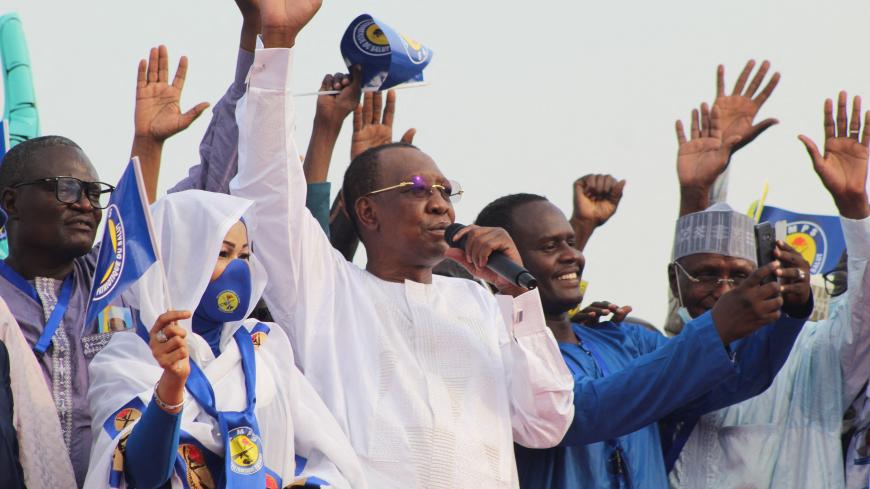Chad President Idriss Deby Itno (C) waves at supporters during a campaign rally in N'Djamena, Chad, on March 13, 2021. - Chad President Idriss Deby Itno kicked off his campaign for a sixth term on Saturday, calling for unity after rival protests were banned and broken up. (Photo by Renaud MASBEYE BOYBEYE / AFP) (Photo by RENAUD MASBEYE BOYBEYE/AFP via Getty Images)