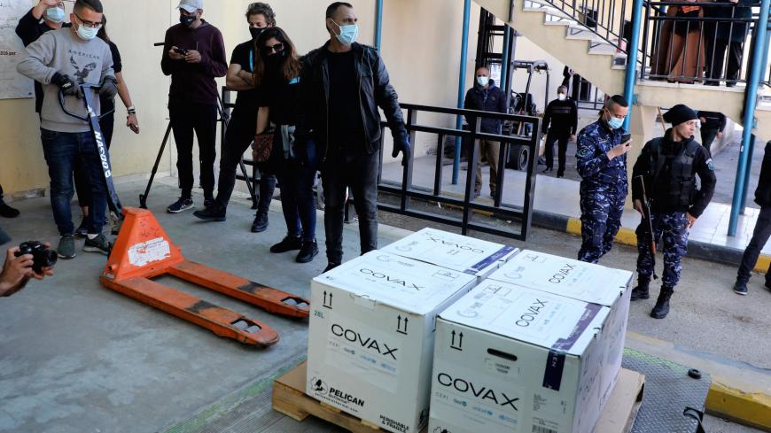 A worker unloads a refrigerated truck carrying the first delivery of coronavirus vaccine via the United Nations Covax programme supporting poorer areas, to be kept at Palestinian Authority's storage facility in the West Bank city of Nablus, on March 17, 2021. - The Palestinian Authority said that vaccination would begin at the end of this week, primarily for those aged over 75, cancer patients and medical personnel.
Earlier, some 60,000 doses of Pfizer and AstraZeneca vaccines allocated to the Palestinians 