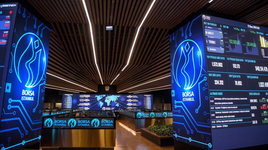 Grapfics and numbers of trade markets are screened on the floor of the Borsa Istanbul on May 22, 2018 in Istanbul. - Turkey's embattled currency, the Lira, on May 22 hit new historic lows against the US dollar after Fitch ratings agency expressed concerns over the central bank's independence in the wake of comments by President Recep Tayyip Erdogan. (Photo by OZAN KOSE / AFP)        (Photo credit should read OZAN KOSE/AFP via Getty Images)