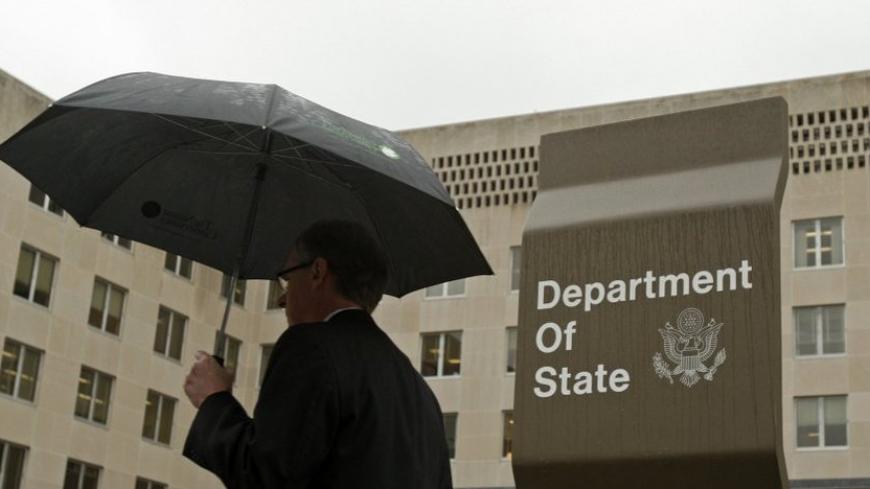 A man leaves the U.S. State Department building in Washington June 5, 2009. Walter Kendall Myers, a former U.S. State Department official, and his wife Gwendolyn Myers have been arrested for spying for the Cuban government for nearly 30 years, the Justice Department said on Friday.   REUTERS/Jim Young    (UNITED STATES CRIME LAW POLITICS) - RTR24C56